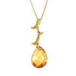 A citrine and diamond pendant, with 18ct gold chain.Chain with hallmarks for 18ct gold.
