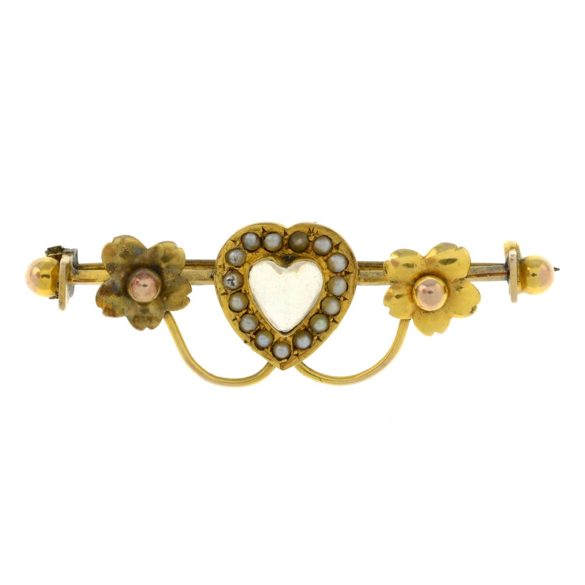 An early 20th century 9ct gold moonstone and split pearl heart bar brooch.Stamped 9ct.Length