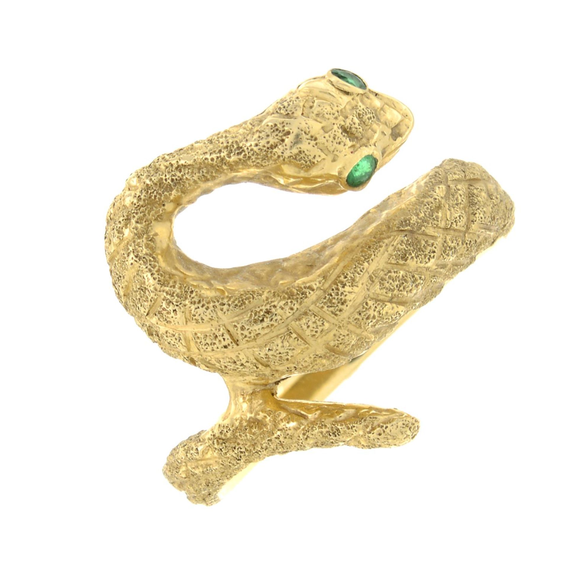 A snake ring, with emerald accents.