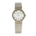 LONGINES - a bracelet watch.White metal case with factory diamond setbezel, stamped 18K 0,750.