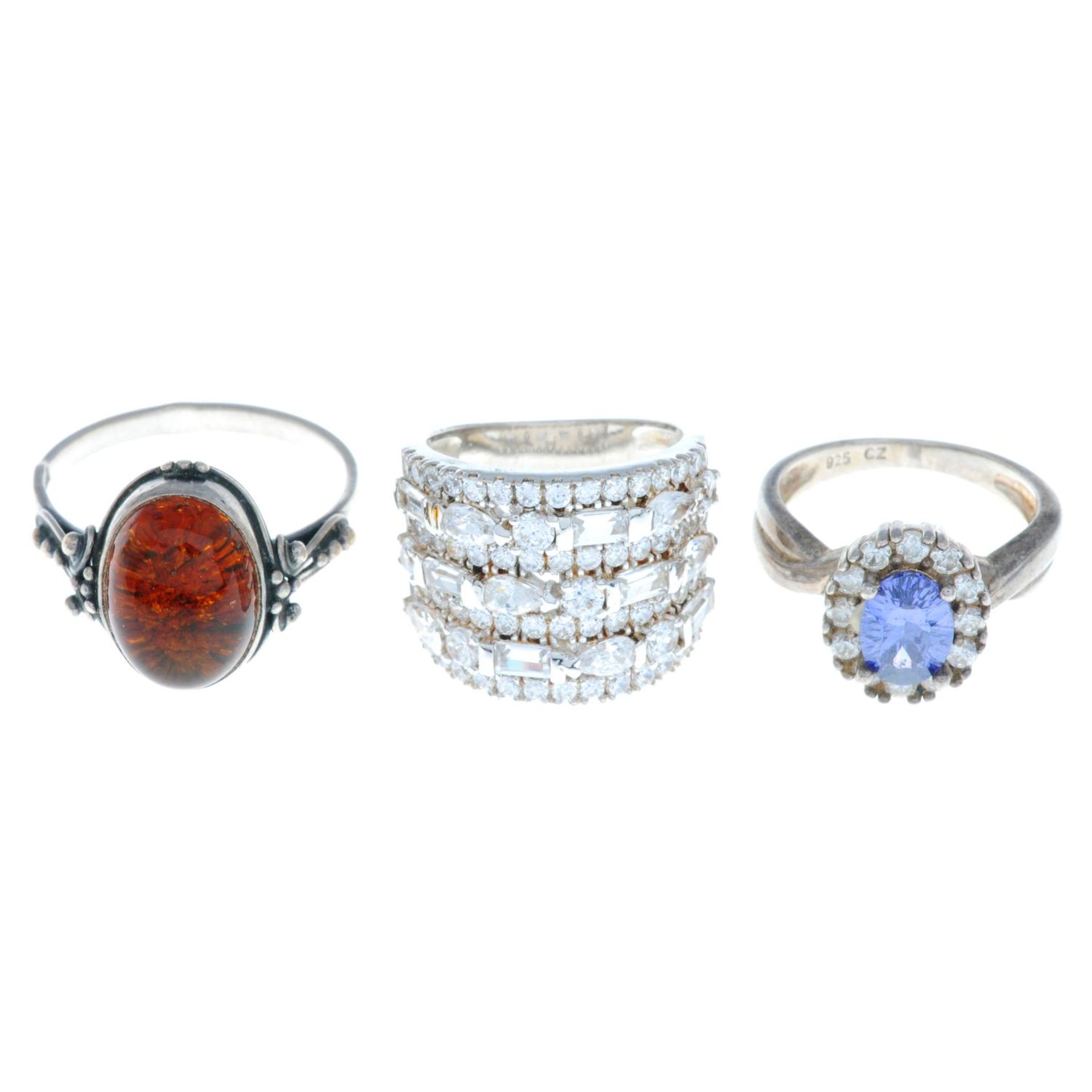 A selection of many gem-set rings, to include a ruby and paste cluster ring.