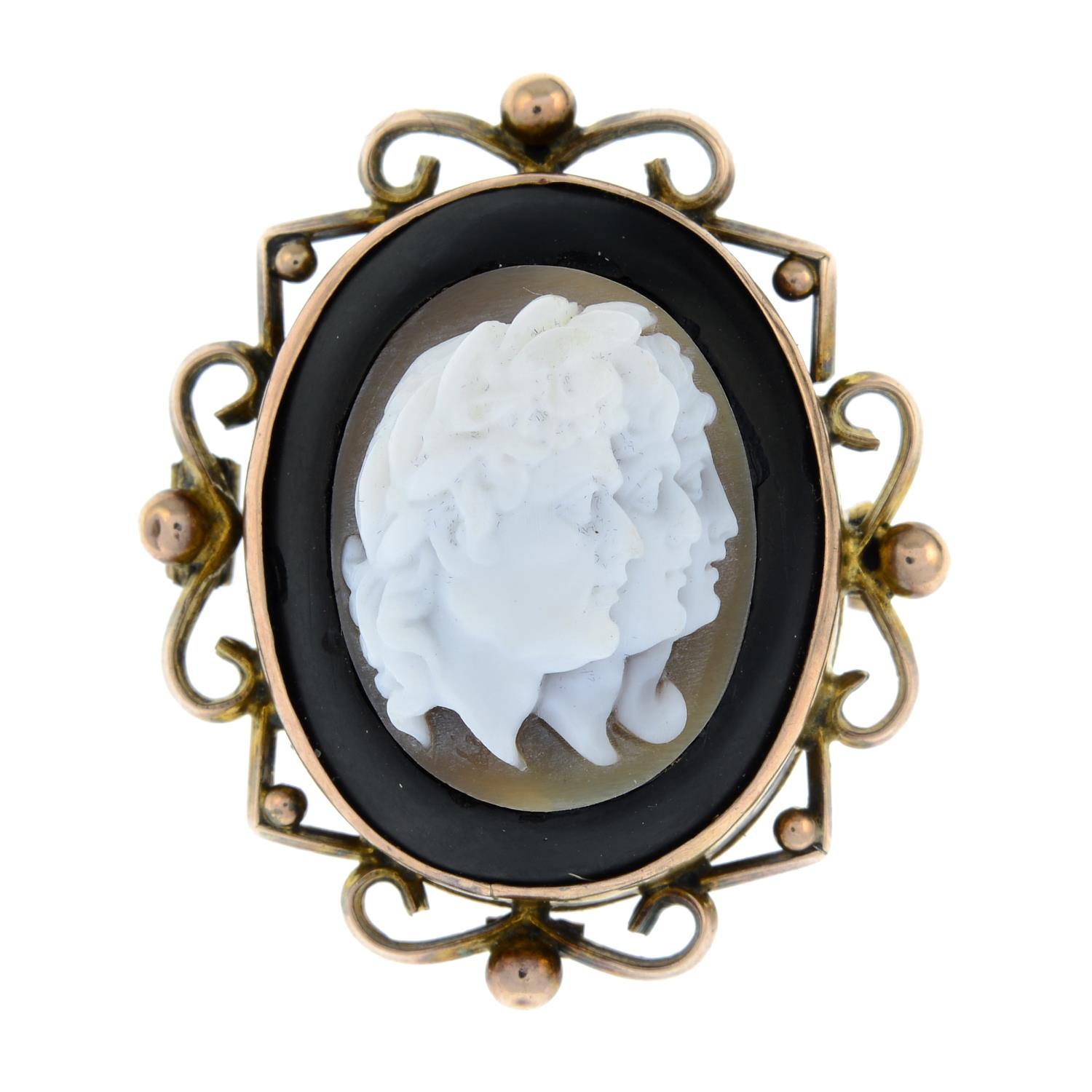 A jet and shell cameo brooch with an openwork surround.Stamped 9ct.Length 3.2cms.