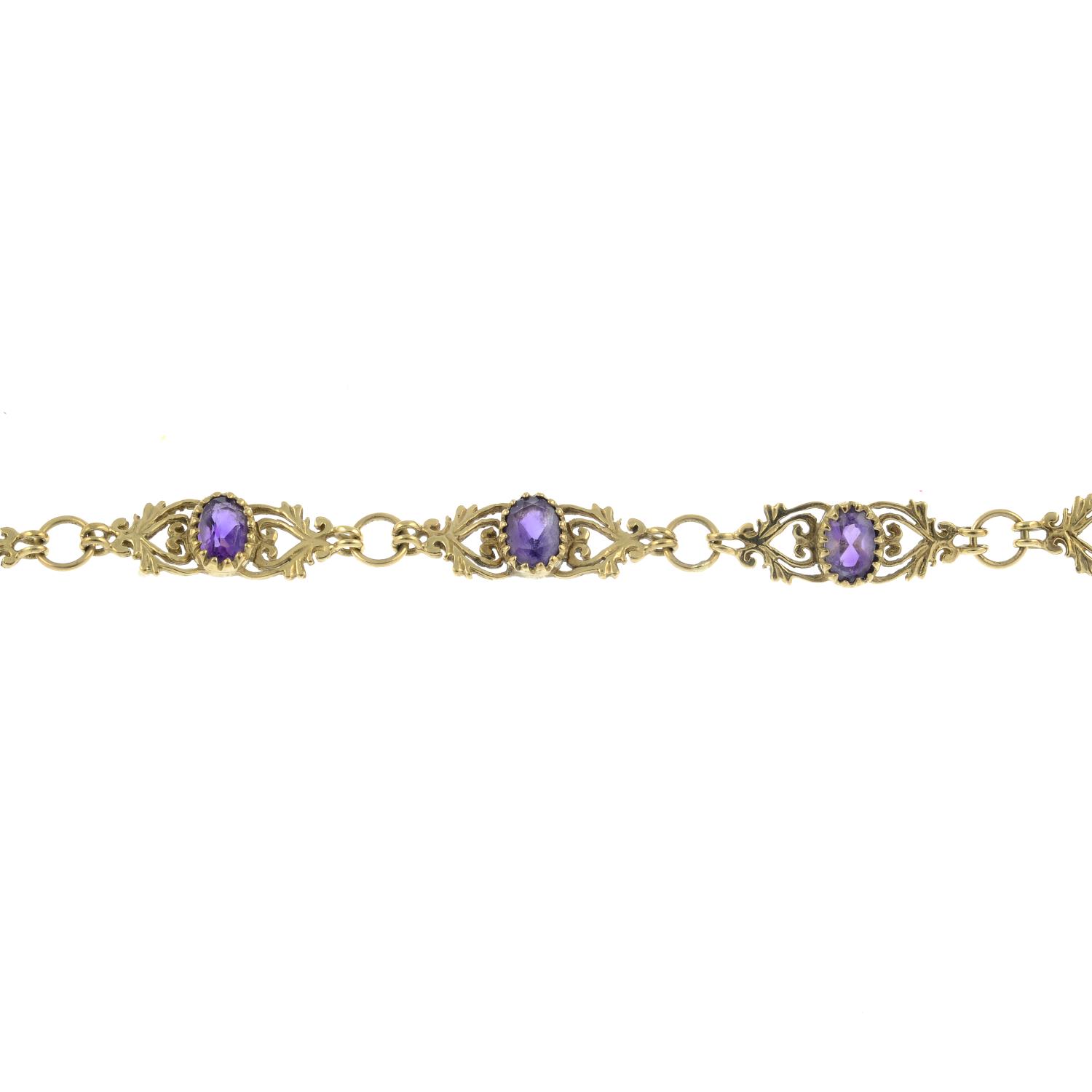 A amethyst bracelet with a pair of 9ct gold amethyst earrings.One with Hallmarks for Birmingham.