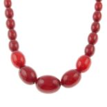 A red bakelite graduated bead necklace.