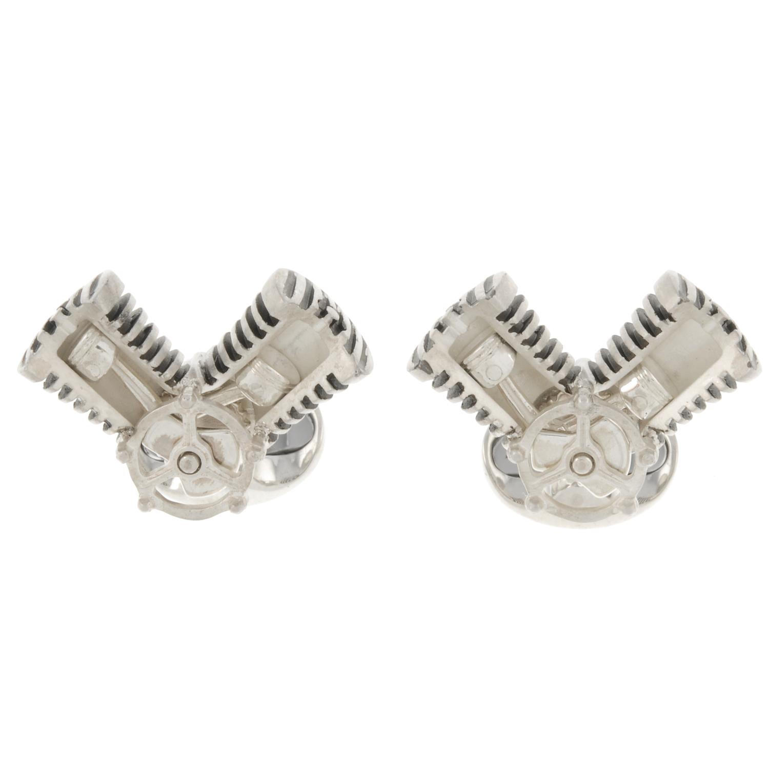 A pair of silver articulating piston cufflinks, by Deakin and Francis.Signed D&F.