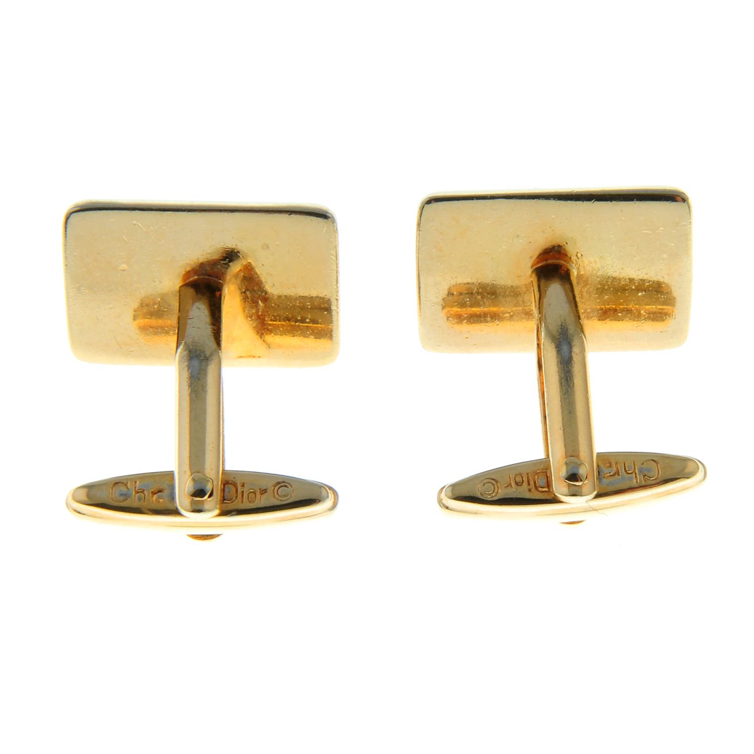 A pair of imitation tortoise shell cufflinks, by Christian Dior.Signed Chr. - Image 2 of 3