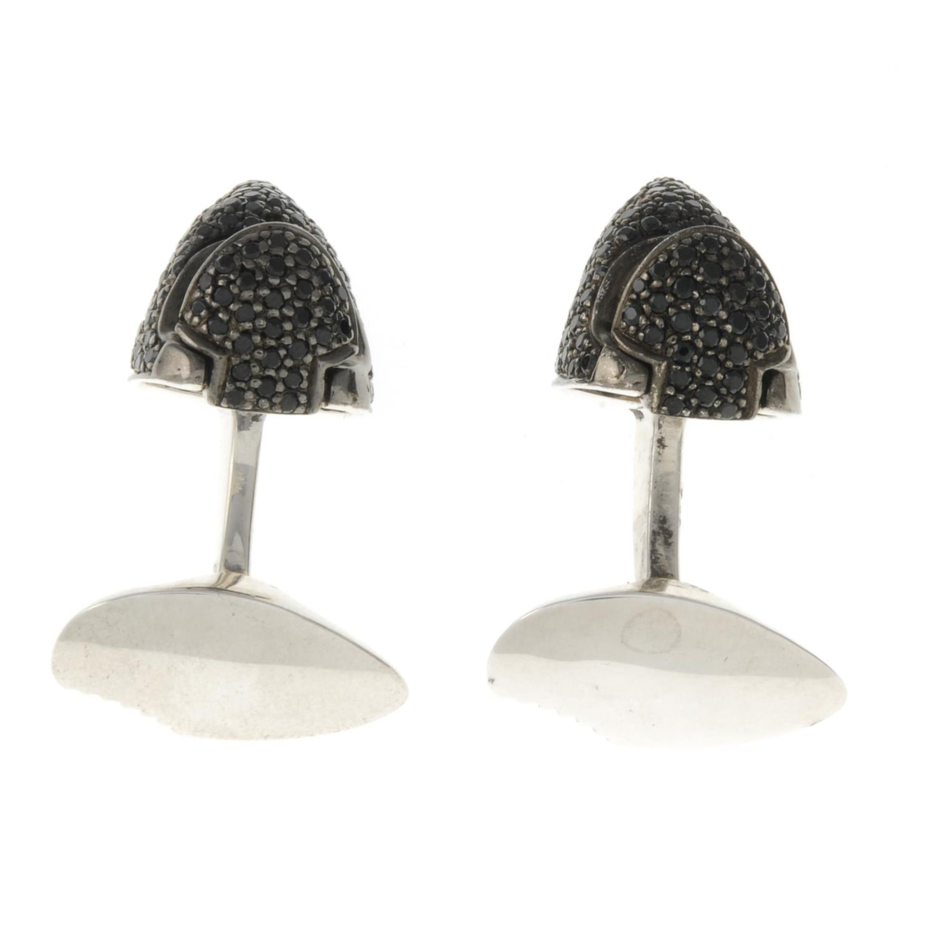 A pair of silver and black spinel shark head cufflinks, - Image 3 of 3