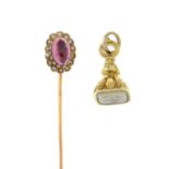 A tourmaline and split pearl stickpin and an intaglio fob.Length of fob 2cms.