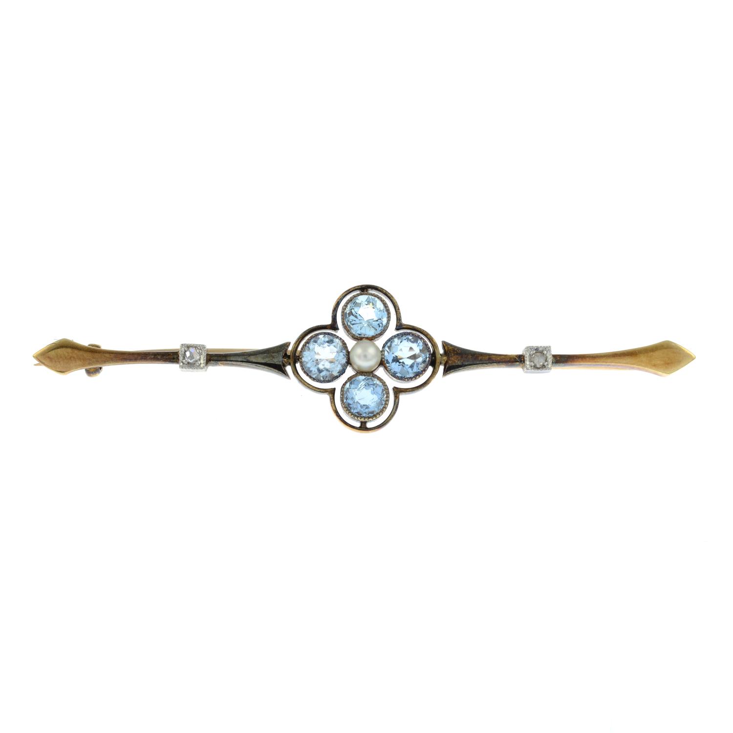 A diamond, aquamarine and seed pearl bar brooch.Stamped 15ct.Length 6.1cms.