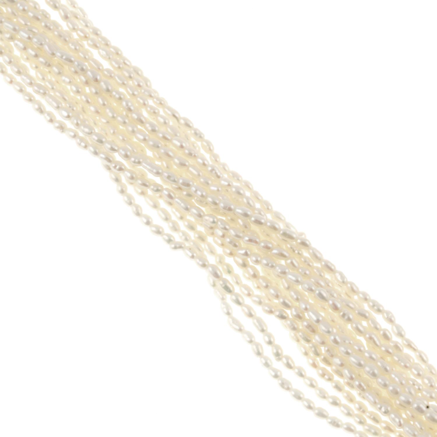 A multi-strand cultured seed pearl necklace.Clasp stamped 925.