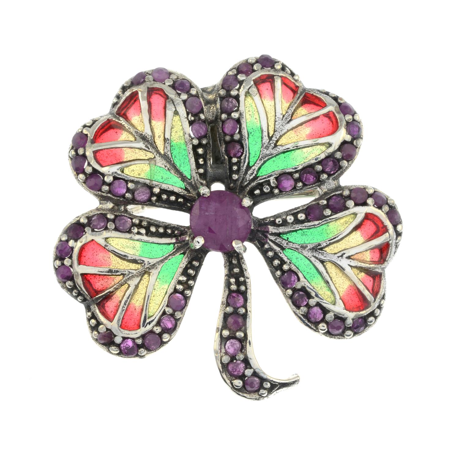 A ruby and plique-a-jour enamel brooch of a four-leaf clover.May be worn as a pendant.Stamped 925.