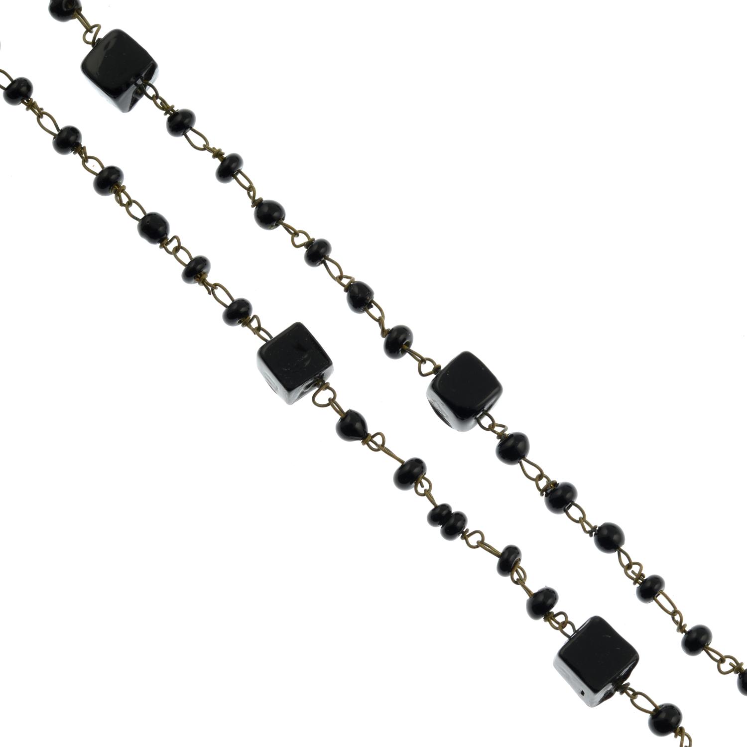 A selection of black glass bead necklaces and buttons,