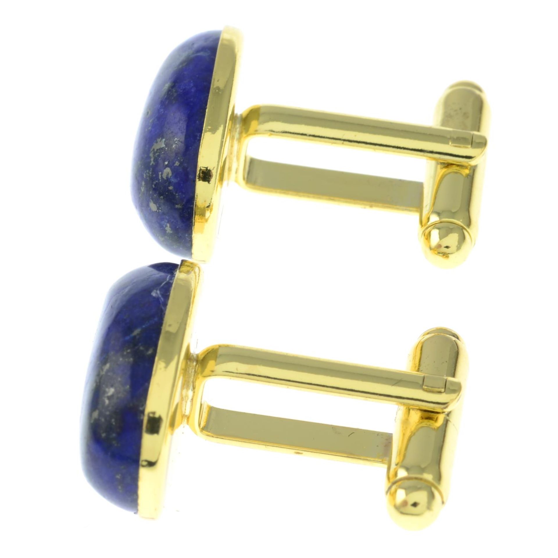 A pair of oval lapis lazuli cufflinks.Length of cufflink face 1.9cms. - Image 2 of 2