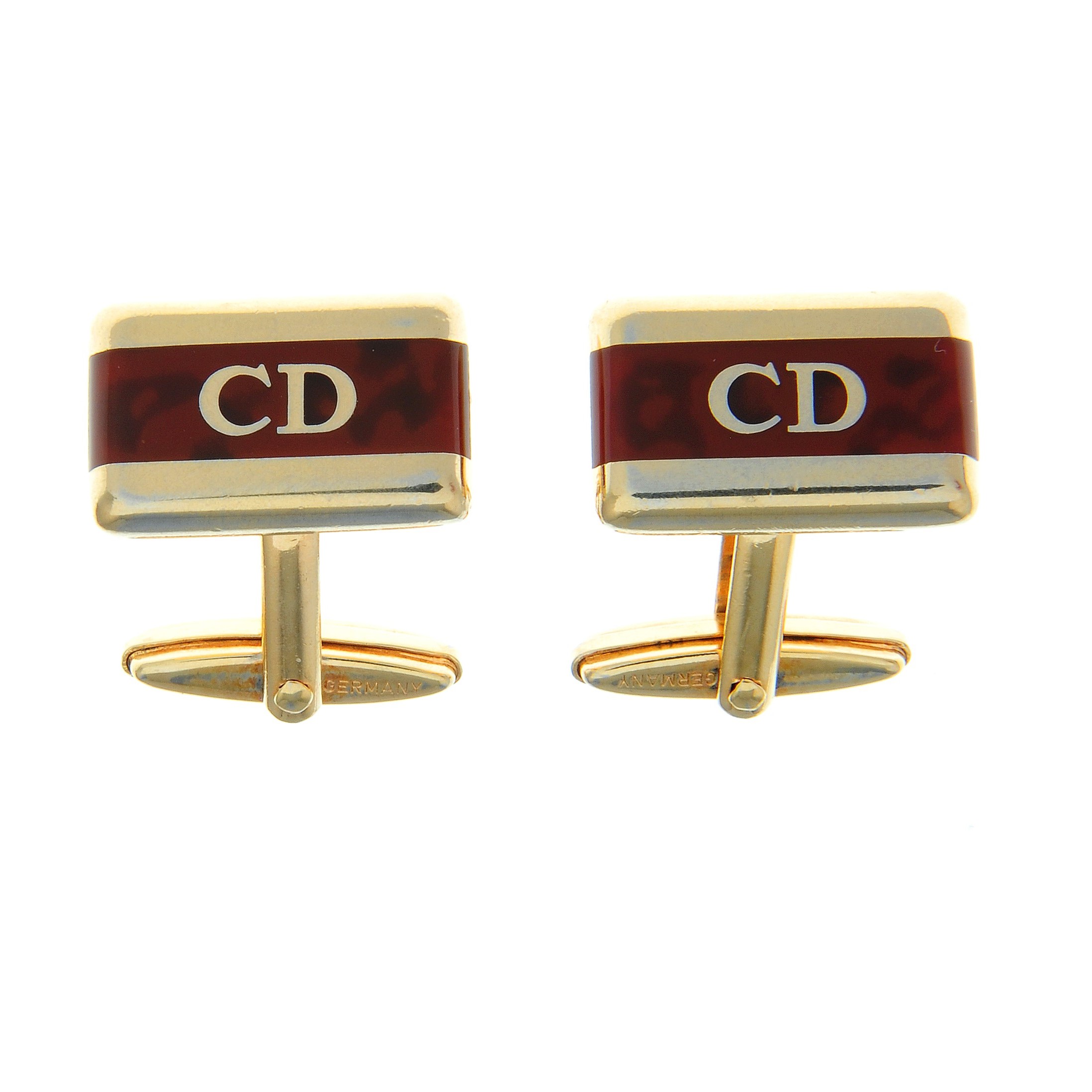 A pair of imitation tortoise shell cufflinks, by Christian Dior.Signed Chr.