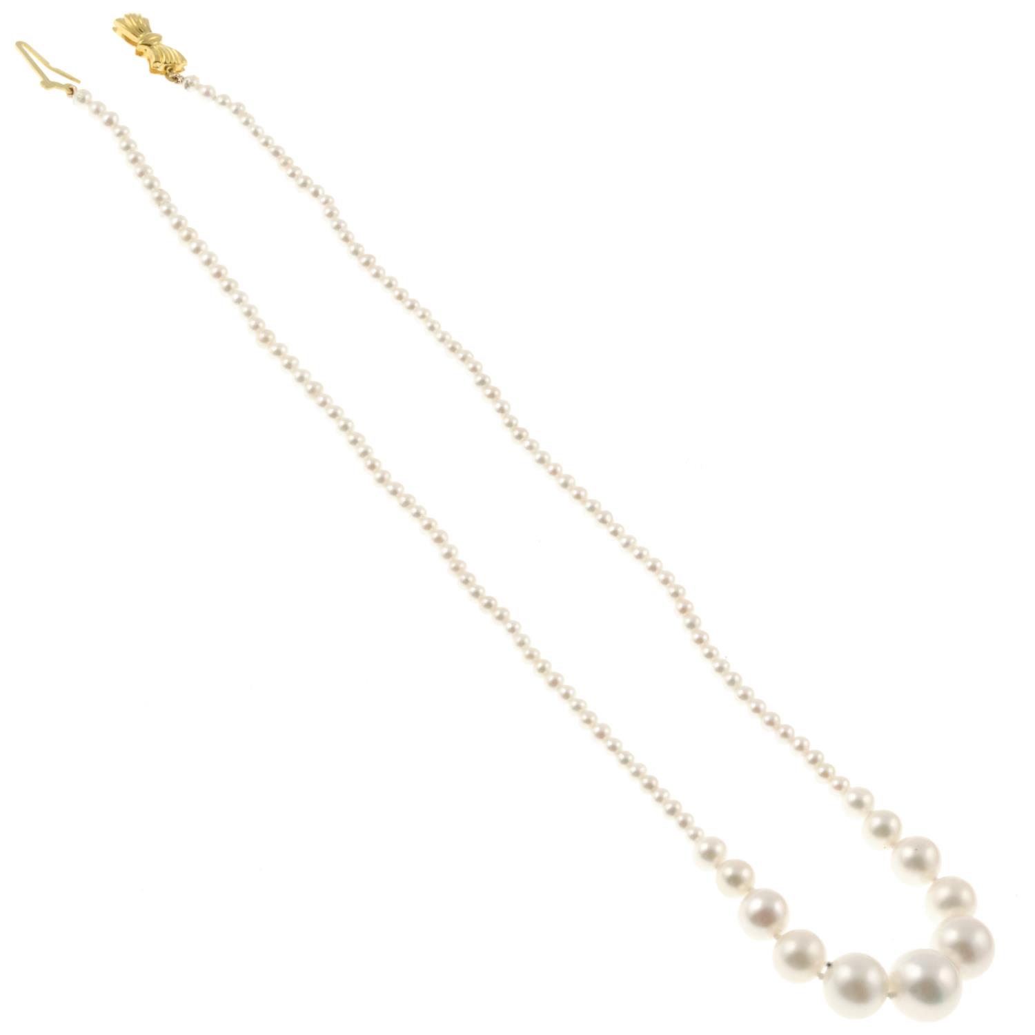 A graduated cultured freshwater pearl necklace, with bow clasp.Clasp stamped 375.Length 37.5cms. - Image 2 of 2