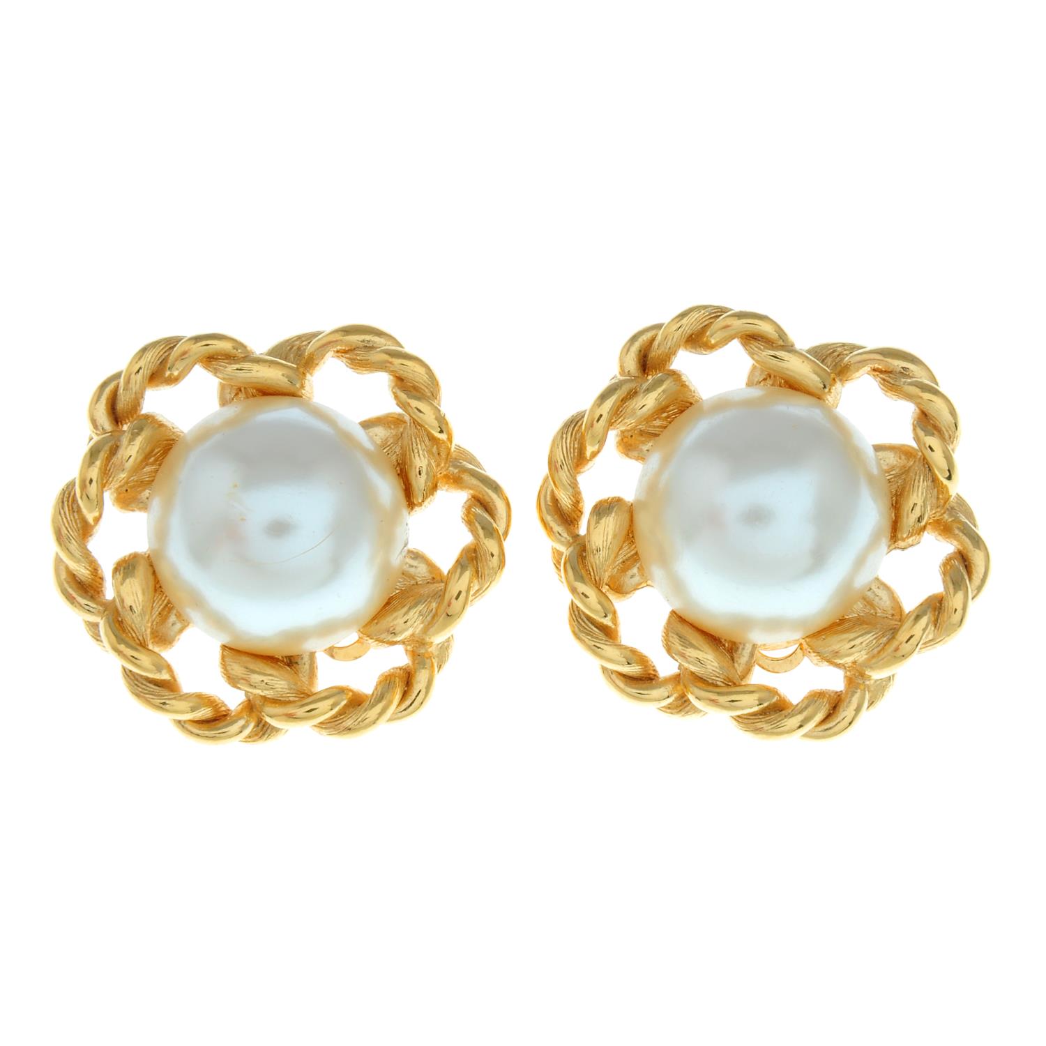 A pair of imitation pearl clip-on earrings with a rope textured floral surround,