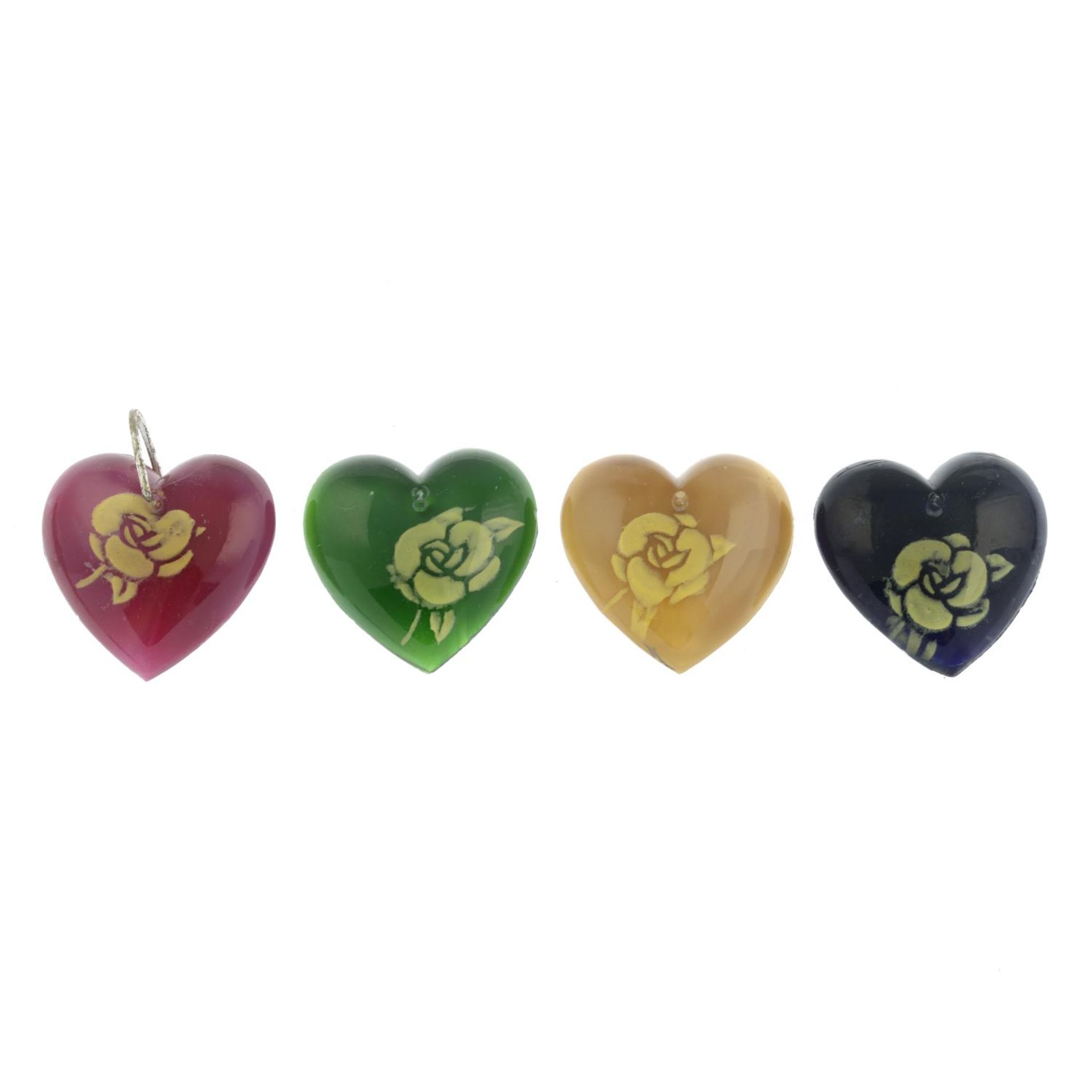 A selection of approximately one-hundred-and-twenty coloured glass hearts with rose motifs.