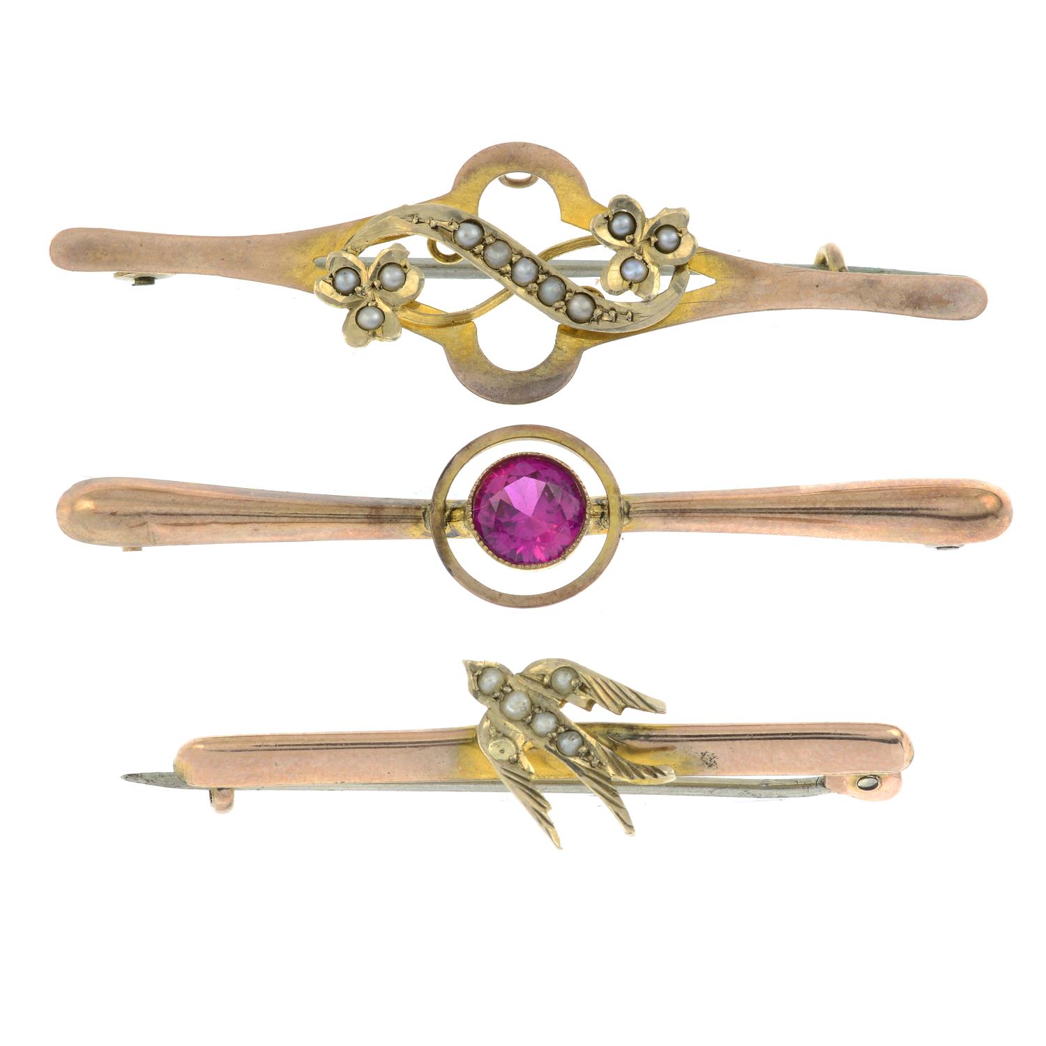 A synthetic ruby bar brooch, along with a seed two seed pearl brooches.
