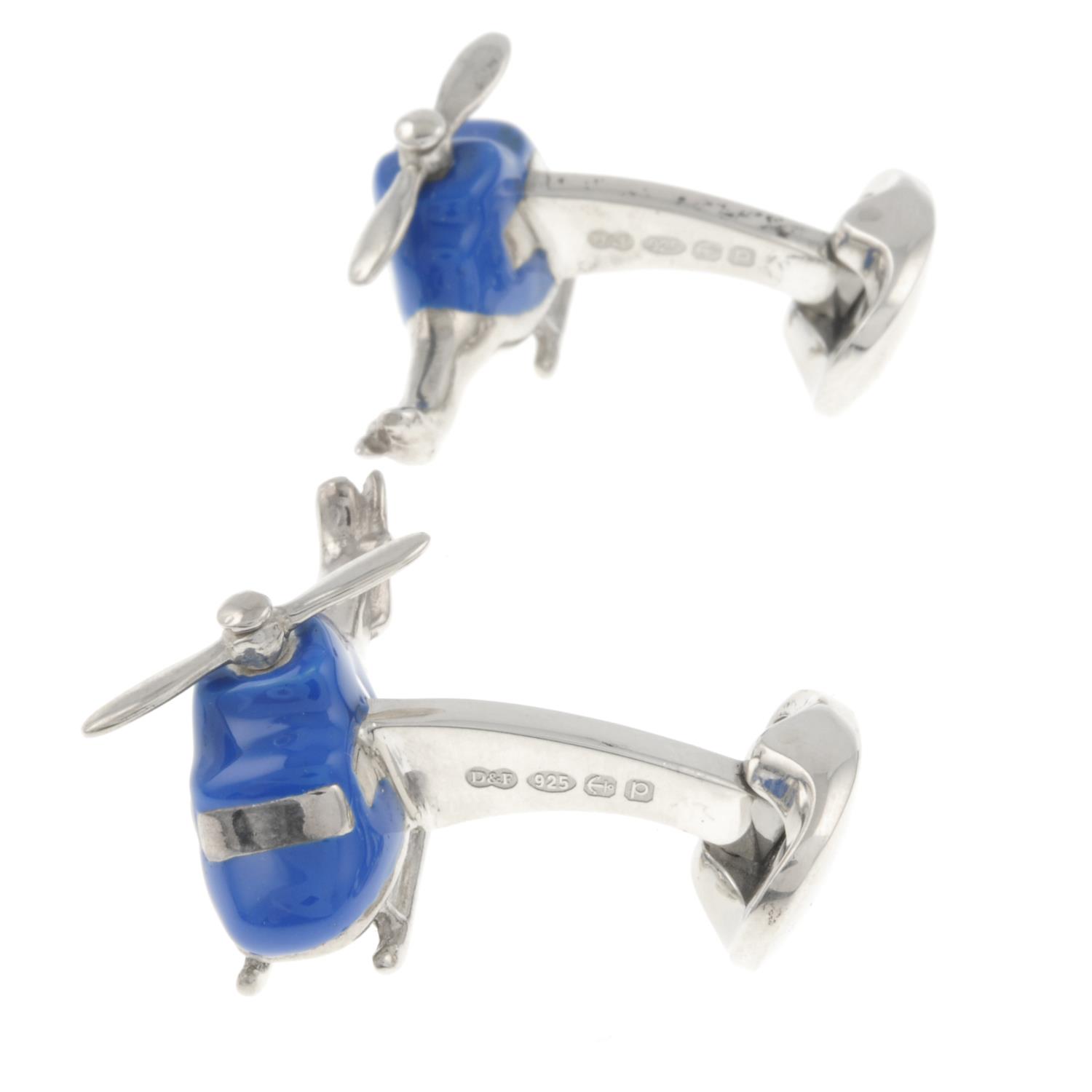 A pair of silver and blue enamel helicopter cufflinks with rotating propeller, - Image 2 of 2