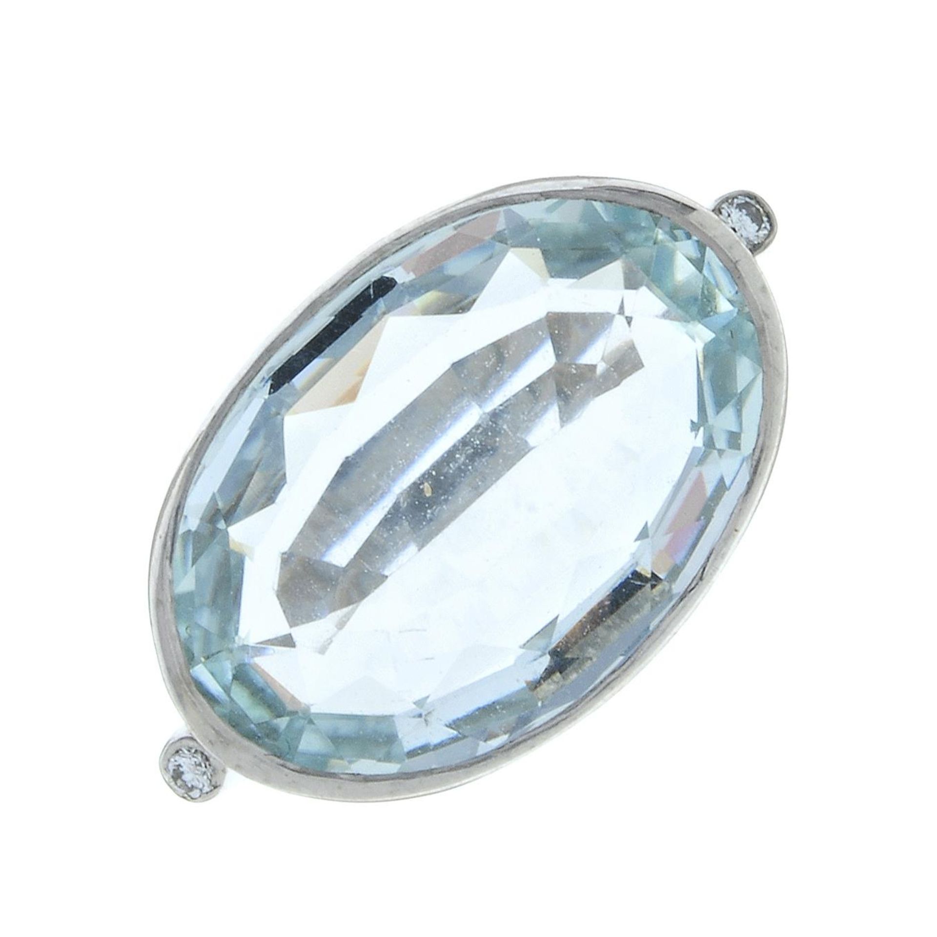 An 18ct gold aquamarine and brilliant-cut diamond dress ring.Aquamarine calculated weight 9cts,