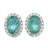 A pair of emerald and brilliant-cut diamond cluster earrings.Total emerald weight 0.80ct,