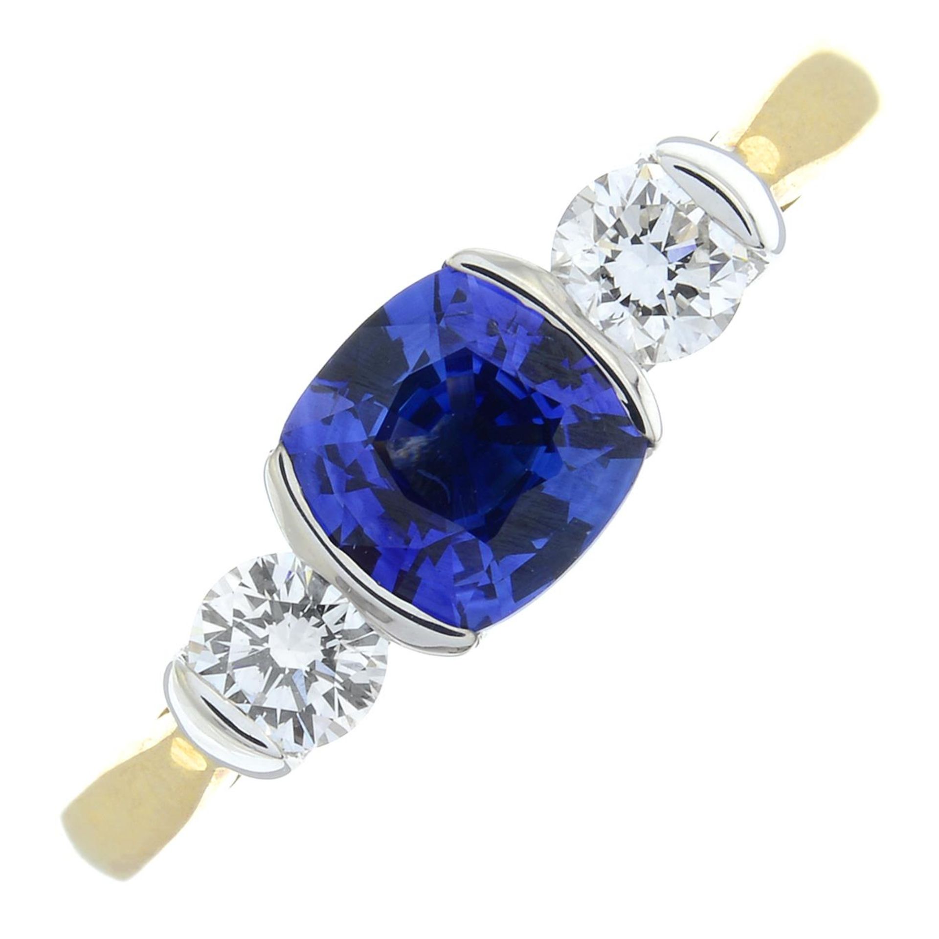 An 18ct gold sapphire and brilliant-cut diamond three-stone ring.Sapphire calculated weight 0.65ct,
