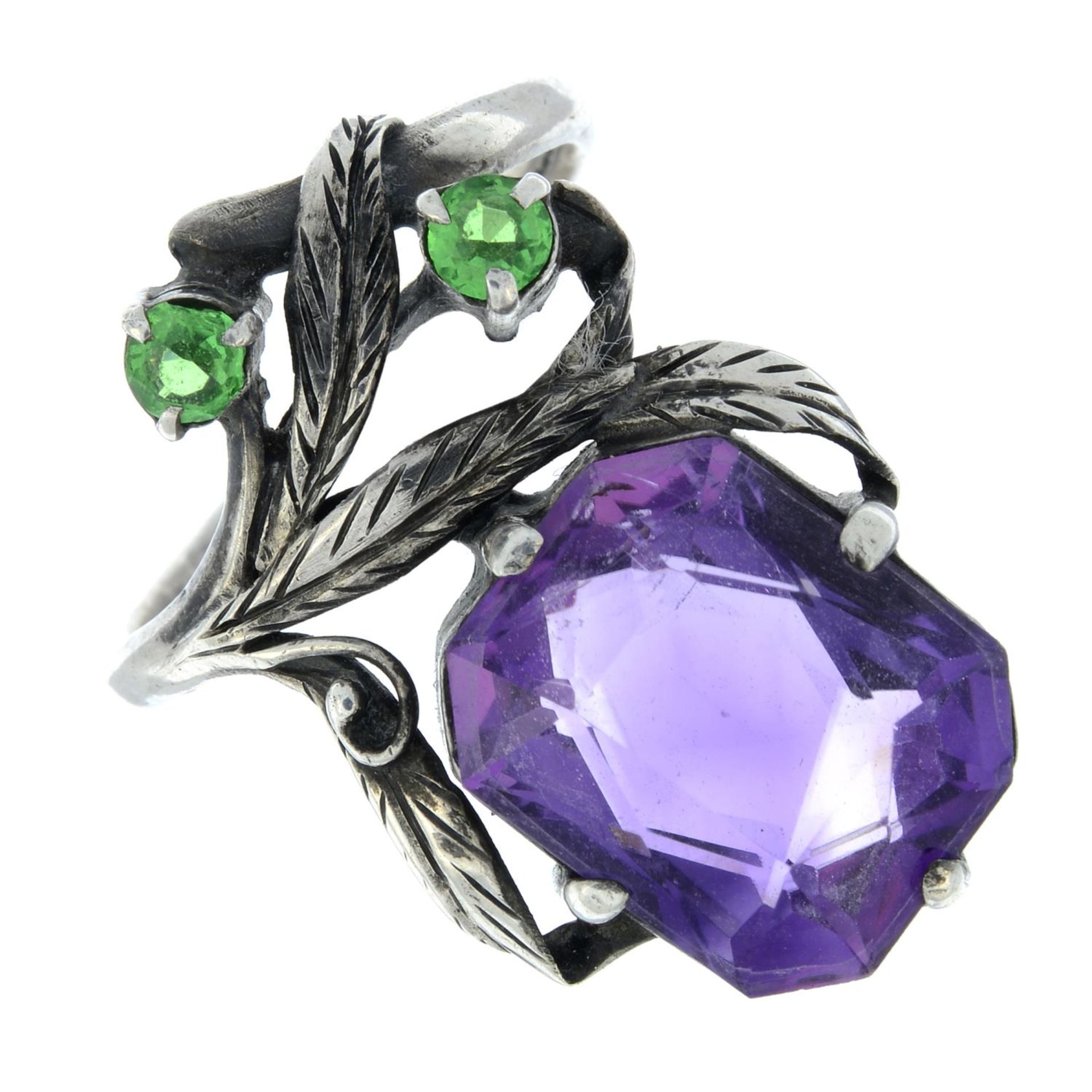 An Arts and Crafts silver amethyst and demantoid garnet ring,