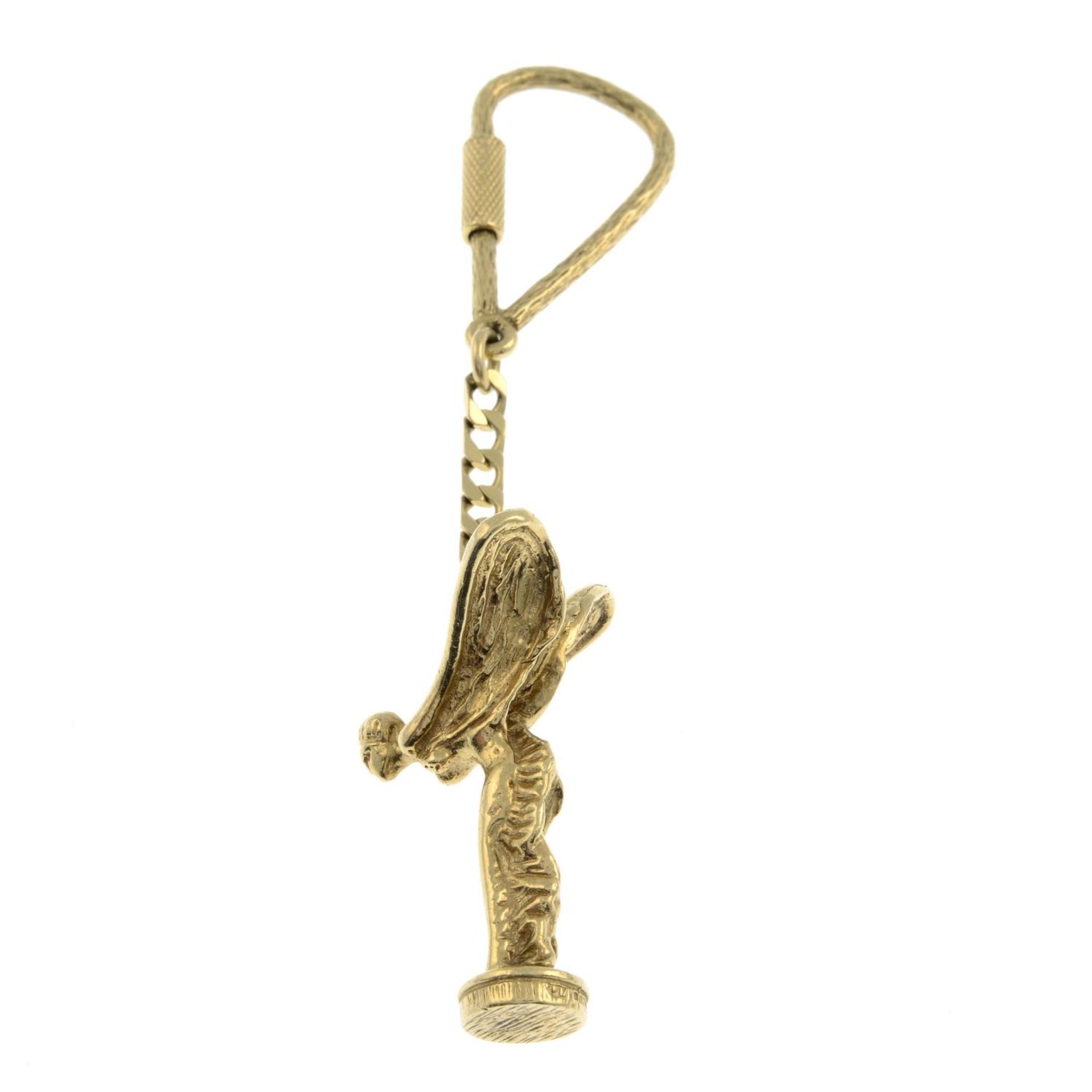 A 9ct gold key ring, suspending a Spirit of Ecstasy charm.Hallmarks for London 1989. - Image 2 of 3