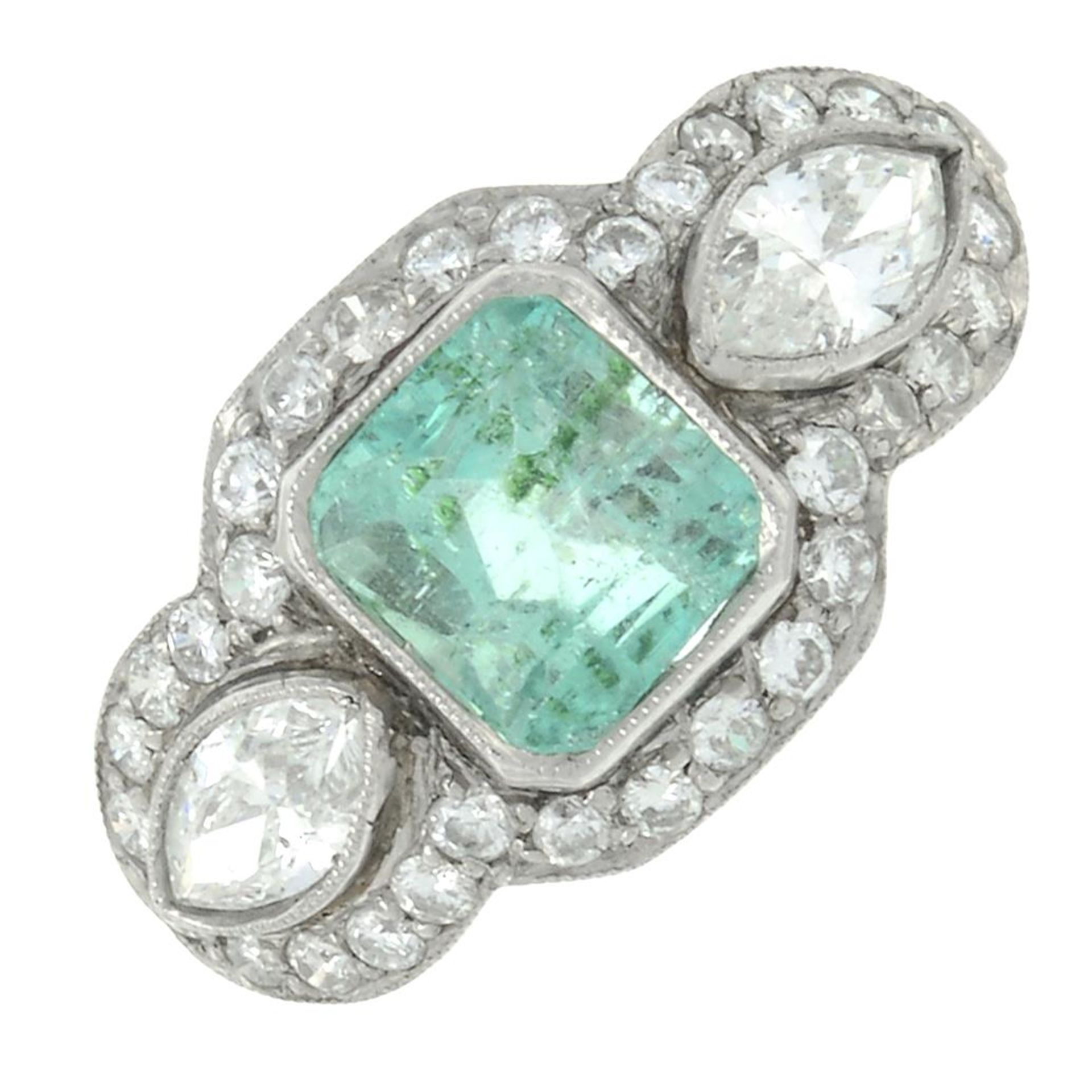 An emerald dress ring, with marquise-shape diamond sides, within a brilliant-cut diamond surround.