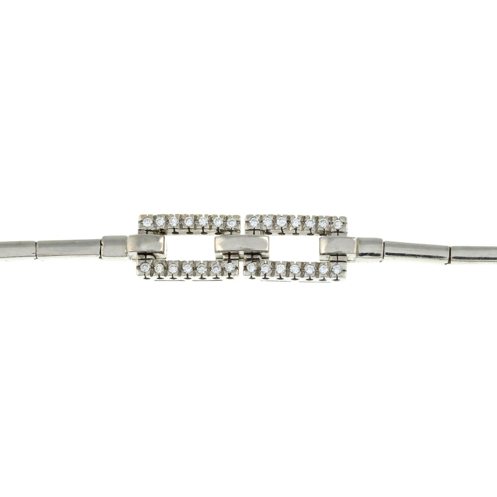 A bracelet, with rectangular-shape links and brilliant-cut diamond openwork panel