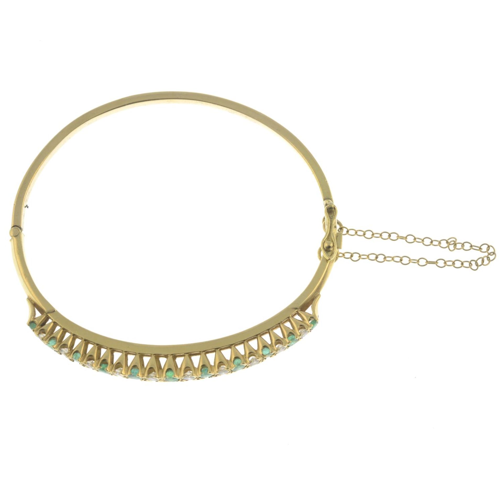 An emerald and diamond bangle, hinged to the plain reverse. - Image 2 of 2