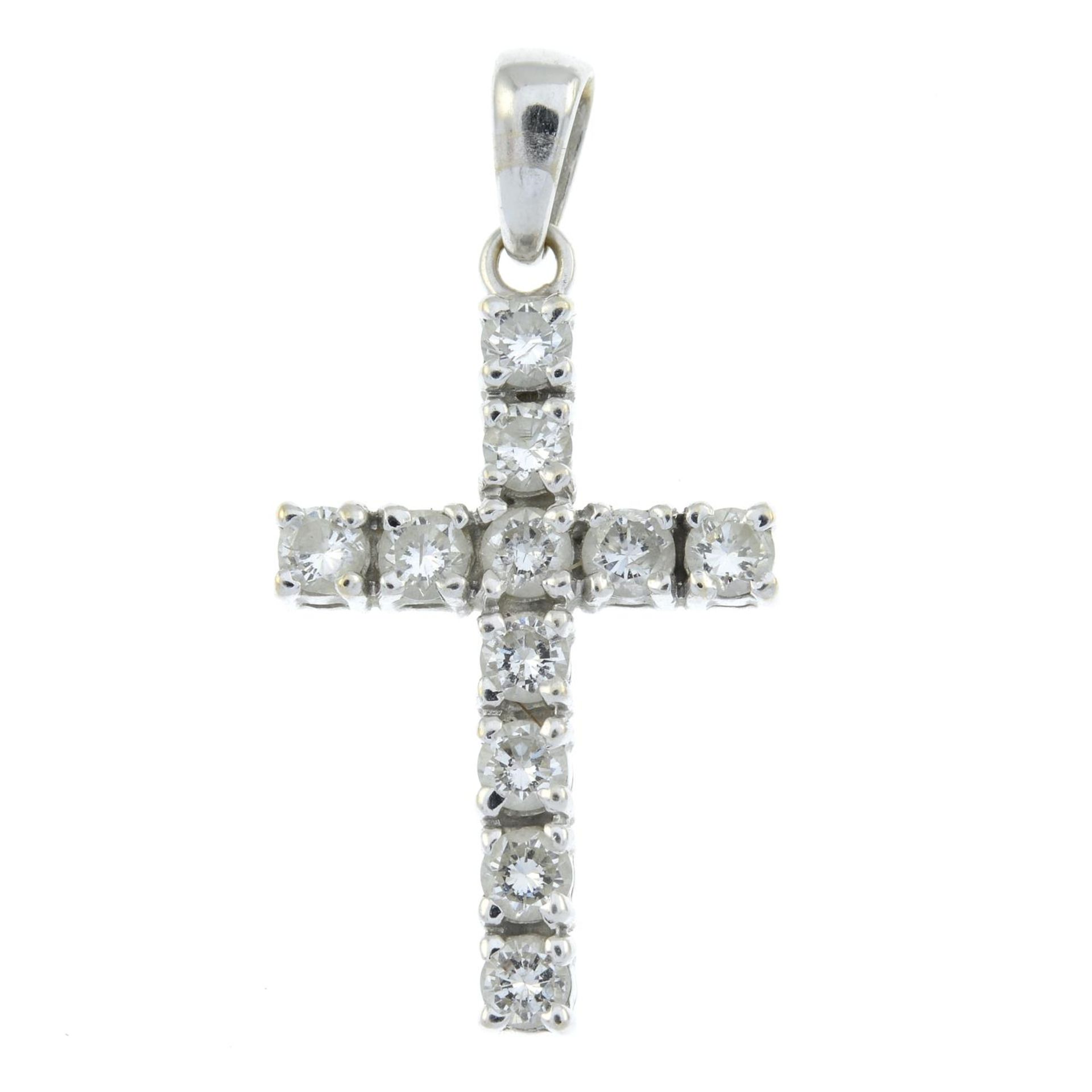A brilliant-cut diamond cross pendant.Estimated total diamond weight 0.90ct,