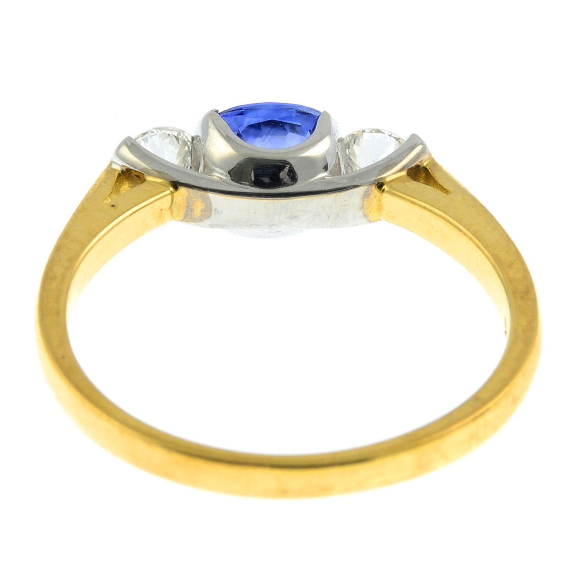 An 18ct gold sapphire and brilliant-cut diamond three-stone ring.Sapphire calculated weight 0.65ct, - Image 2 of 3