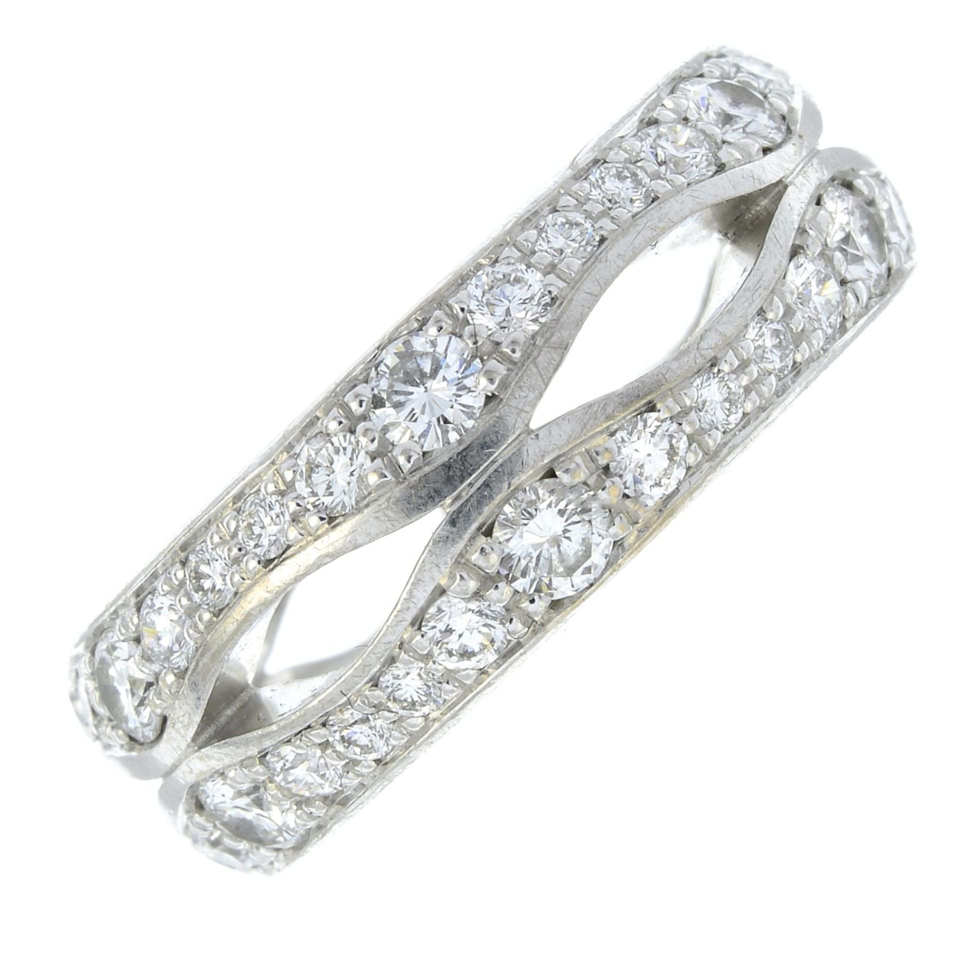 An 18ct gold brilliant-cut diamond openwork band ring.Total diamond weight 0.66ct, marked to band.