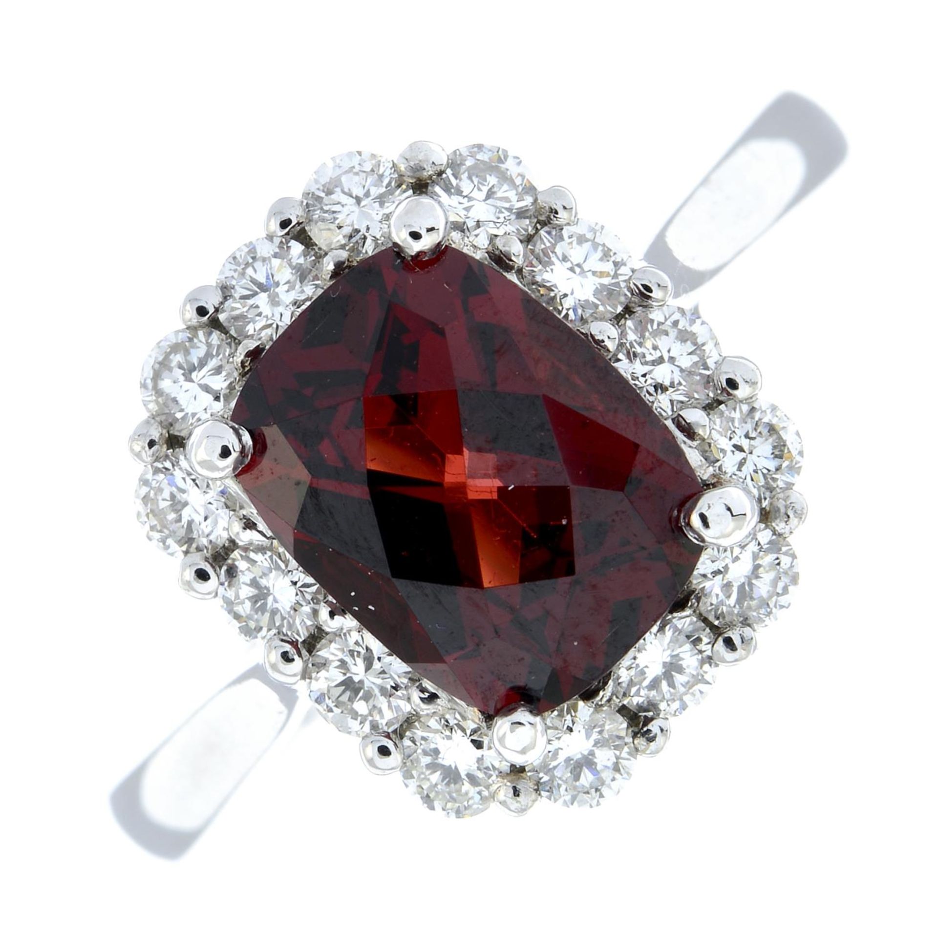 A garnet and brilliant-cut diamond cluster ring.Garnet weight 2.41ct.Total diamond weight 0.57ct,