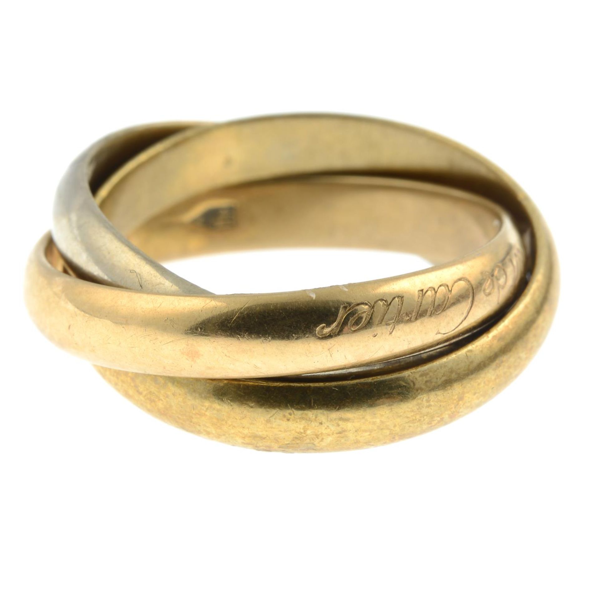 A 'les must de Cartier' trinity ring, by Cartier.Signed Cartier.Stamped 750.Ring size M1/2. - Bild 2 aus 3