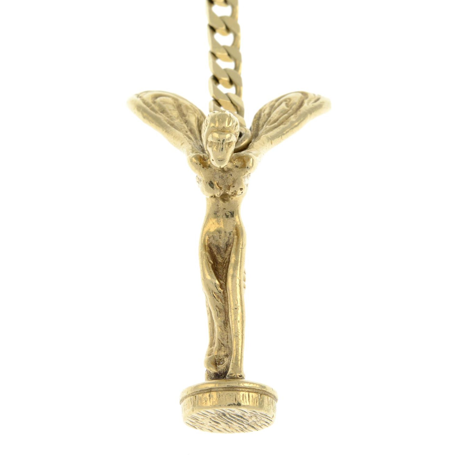 A 9ct gold key ring, suspending a Spirit of Ecstasy charm.Hallmarks for London 1989.