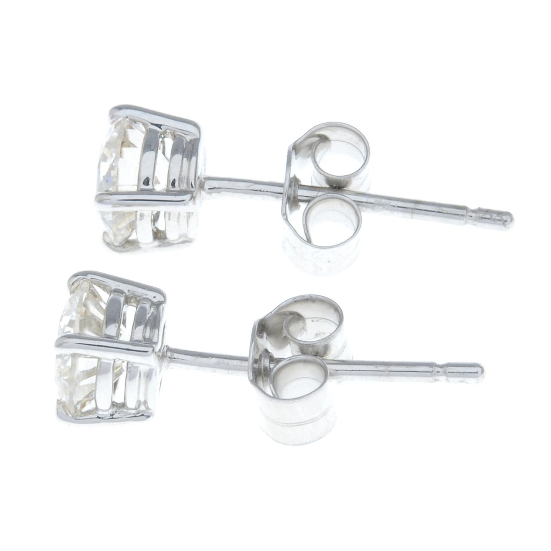 A pair of 18ct gold brilliant-cut diamond single-stone stud earrings. - Image 2 of 2