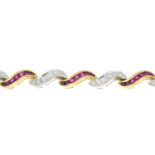 An 18ct bi-colour gold ruby and brilliant-cut diamond scrolling bracelet.Total ruby weight