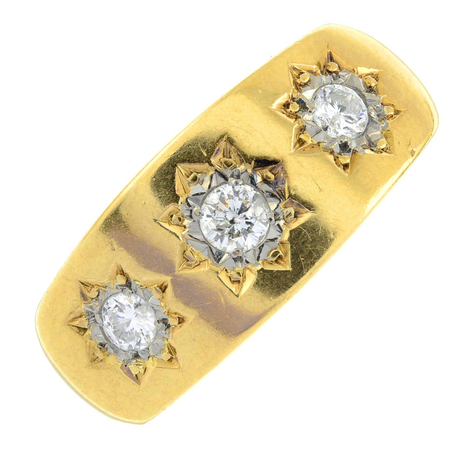 An 18ct gold brilliant-cut diamond three-stone ring.Estimated total diamond weight 0.35ct,