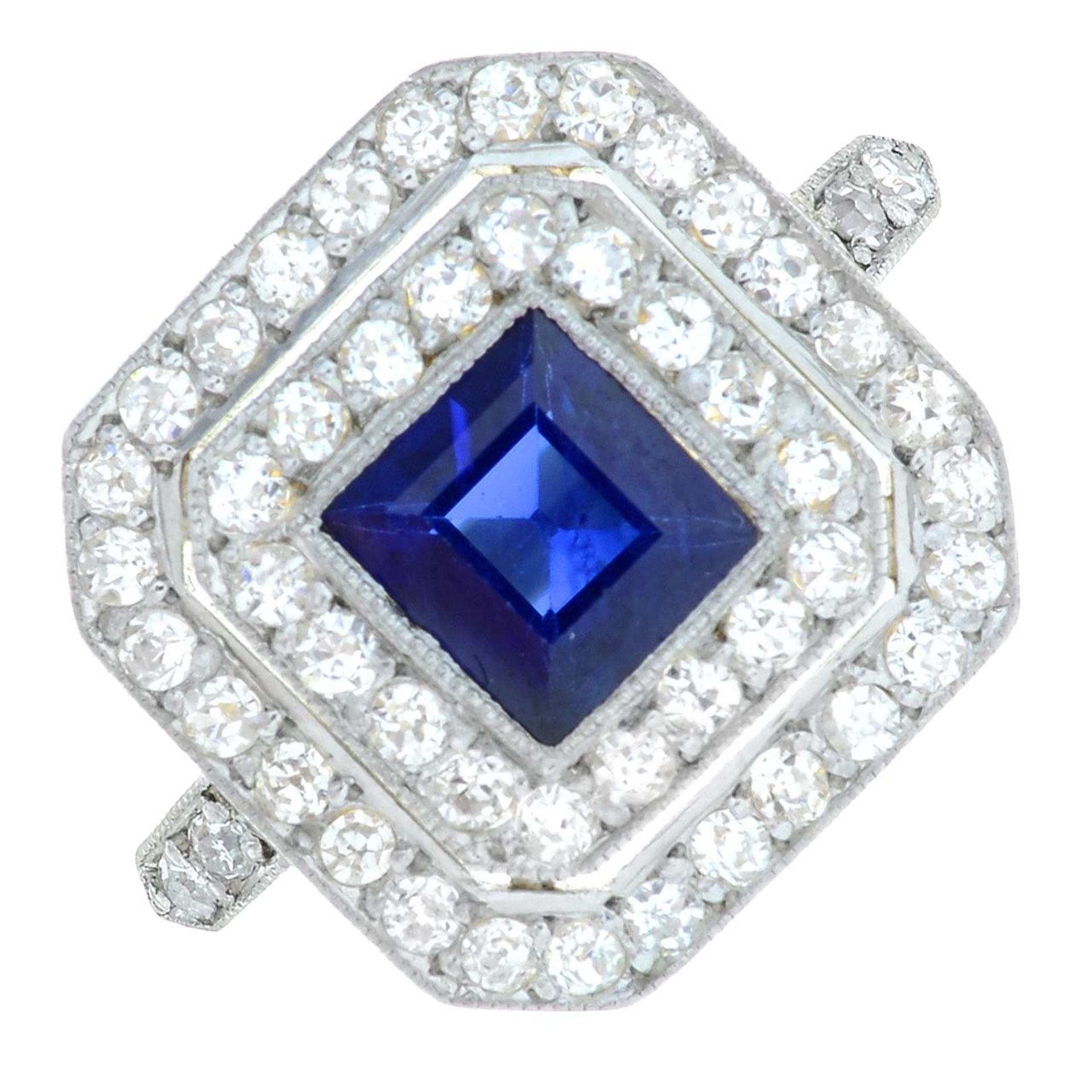 A mid 20th century 18ct gold sapphire and old-cut diamond double cluster ring.Estimated sapphire