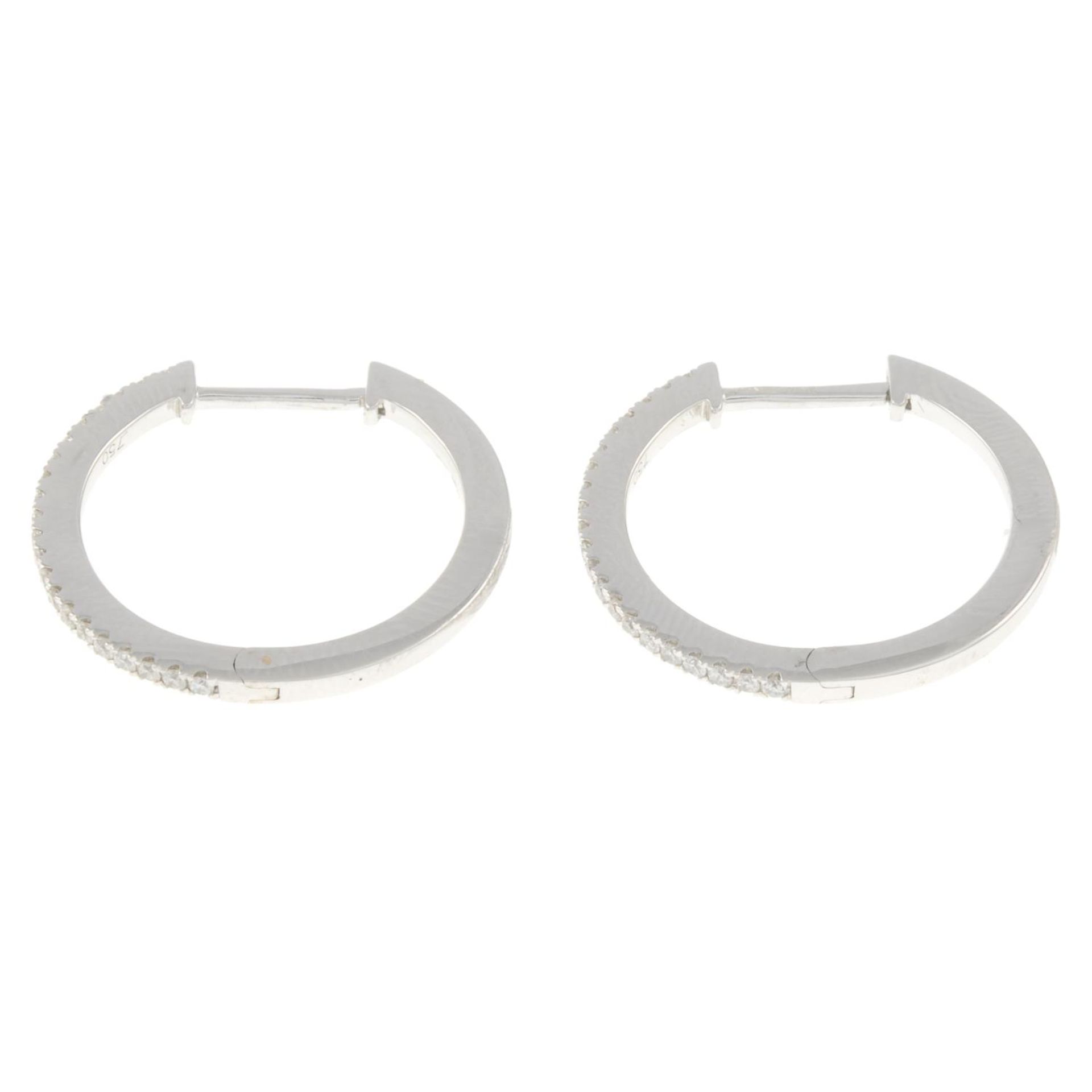 A pair of 18ct gold brilliant-cut diamond hoop earrings, - Image 3 of 4