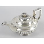 A late George III silver teapot,