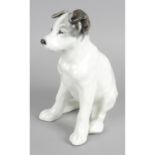 A Russian porcelain figure modelled as a Terrier dog in seated pose.