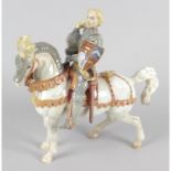 A Beswick figure, modelled as a knight in armour (the Earl of Warwick) mounted upon horseback.