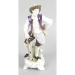 A Kammer / Volkstedt porcelain figure modelled as a male gardener,
