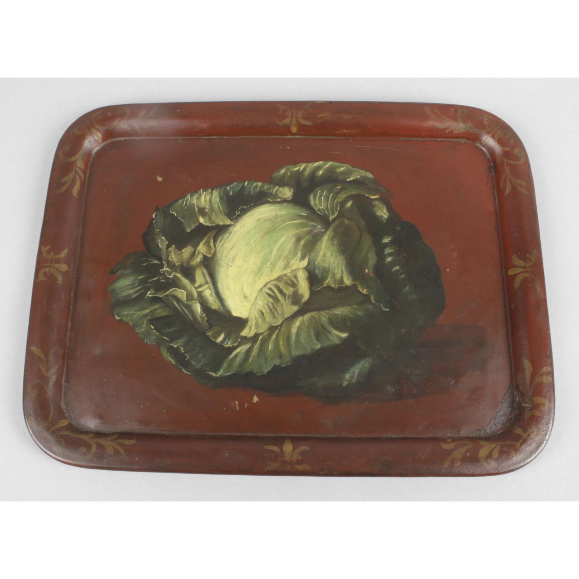 A late nineteenth century rectangular metal tray with raised border,