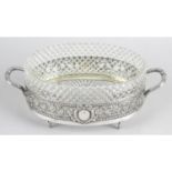 A German silver dish with cut glass liner,