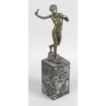 A bronze figure modelled as a naked young boy with catapult,