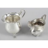 An early George V silver cream jug,
